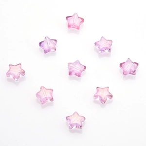 Detail of 10mm star-shaped translucent pink crystal pendants with gold dust and glitter