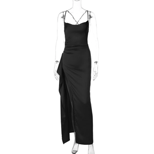 Detail of elegant black satin evening dress showing a sexy high side slit and silky texture