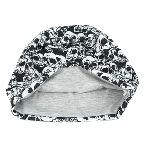Winter knit skull print beanie hat with warm grey inner lining for outdoor streetwear style