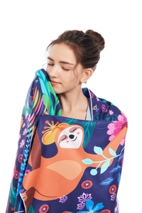 Microfiber beach towel with floral sloth print shown wrapped around a female model