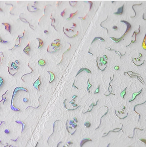 Macro detail of holographic 3D wave line nail stickers with colorful laser effect