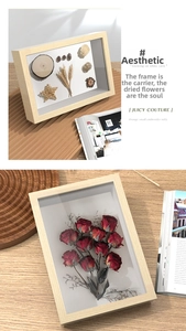 Macro detail of natural light wood shadow box frame for 3D dried flower specimens display