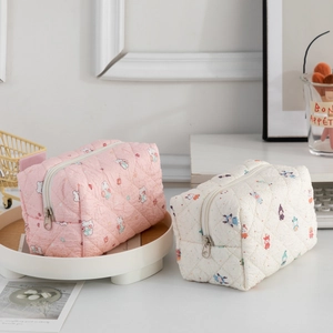 Quilted cotton makeup bag with cute animal patterns in soft pink and cream colors