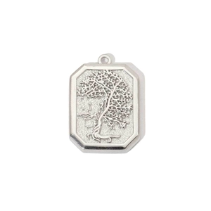 Macro view of silver octagonal stainless steel pendant with engraved Tree of Life design