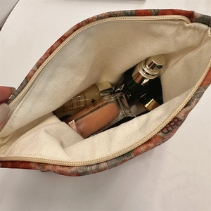 Internal view of the orange corduroy leopard print makeup bag showing large capacity