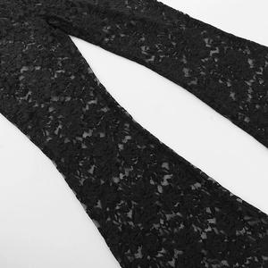 Detail of black floral lace fabric with semi-transparent texture and flared leg design