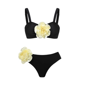 Two-piece black bikini set with 3D floral accents and high-cut bottoms for beachwear