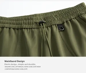 Detalle de pantalón cargo verde militar con cintura elástica, cordón ajustable y anillo en D