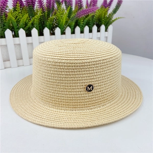 Flat top straw sun hat in beige with decorative gold-tone M letter logo on the side