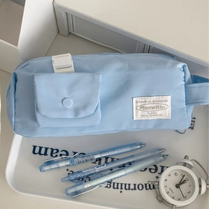 Sky blue quilted pencil pouch with front buckle pocket and sleek minimalist design