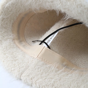 Japanese style white plush bucket hat for women with fluffy texture and inner lining details