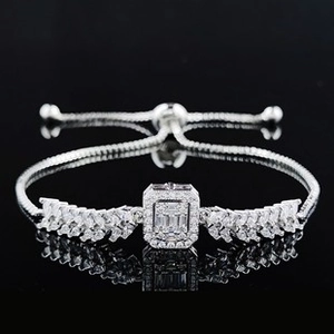Detail of silver adjustable bracelet with sparkling zircon wing clusters and sliding clasp