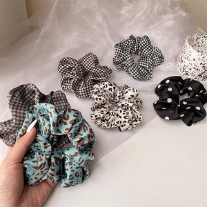 Set of six elegant silk scrunchies with leopard, houndstooth, and polka dot patterns