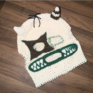Detailed handmade crochet balaclava with funny monster face and asymmetric horns