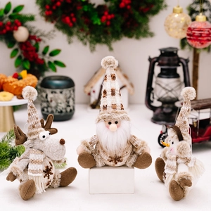 Knitted Christmas ornament set featuring Santa, reindeer, and snowman in beige and brown