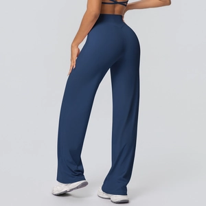 Rear view of dark blue high-waisted flared yoga pants showing lift and fit effect