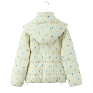 Detail of cream winter parka with blue floral print showing hooded design and puffy texture