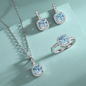 S925 sterling silver jewelry set featuring blue cushion-cut stones on mint display