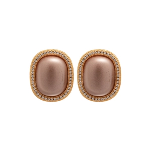 Gold plated oval stud earrings with pink matte stone and white zircon halo on white background