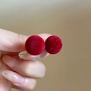 Elegant red flocked spherical stud earrings with silver pins for a vintage luxury style