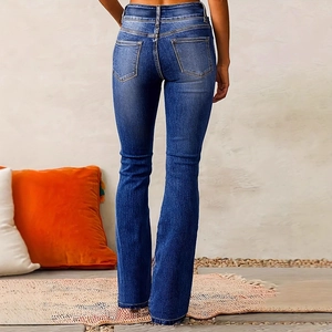 Vintage high-waisted flared blue jeans for women featuring a classic back pocket design