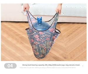 Close-up of foldable floral shopping bag carrying a 20kg water jug to show heavy-duty strength
