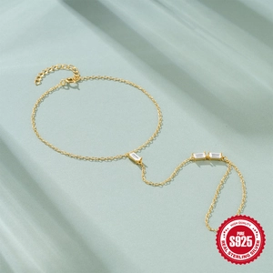 Elegant S925 sterling silver gold plated slave bracelet with baguette cut cubic zirconia