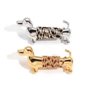 Metallic dachshund brooch set in gold and silver finish with colorful woven rope details