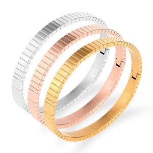 Three-piece set of stainless steel watchband style bracelets in gold silver and rose gold