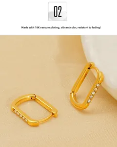 Close-up of 18K vacuum plated U-shaped earrings with inlaid white zircon accents