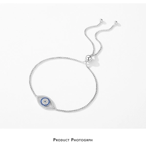 Macro detail of S925 silver Evil Eye bracelet with colorful zircons and sliding clasp