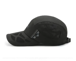 Detail view of black quick-dry sports cap with breathable mesh and reflective strip