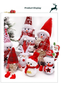 Detailed view of Christmas plush gnome and snowman dolls in festive red and grey fabrics