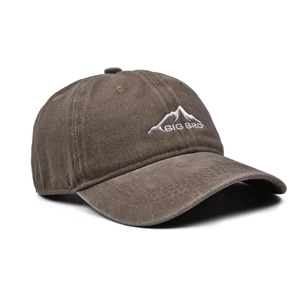 Detailed side view of washed brown baseball cap with white BIG BRO mountain embroidery