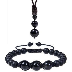 Detail view of obsidian bead necklace and bracelet set with adjustable woven cord