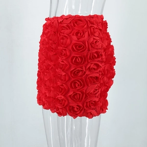 Detail showing red bodycon mini skirt featuring dense 3D rose flower decorations