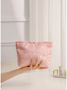 Pink quilted bubble texture cosmetic bag with H&R BAG label for travel storage