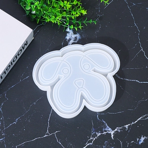 Macro detail of a dog-shaped silicone mold for DIY resin jewelry tray making