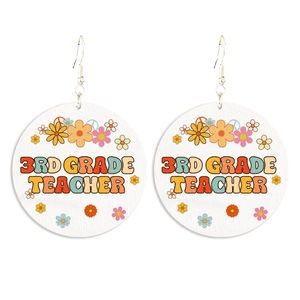 Detail of bohemian wood earrings featuring floral design and 3rd Grade Teacher text