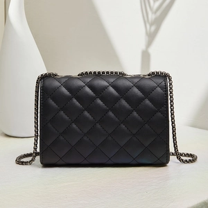 Classic black quilted crossbody bag with rhombic stitching and gunmetal chain strap