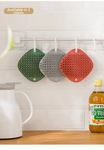 Hanging silicone kitchen cleaning brushes in green, gray, and red for fruit and dishes