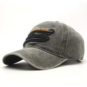 Detail of 3D Hawaii embroidery on dark grey washed cotton baseball cap brim