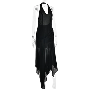 Detail of black halter neck dress featuring sheer mesh fabric and irregular flowing ribbons
