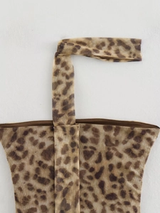 Detailed close-up of leopard print mesh fabric texture on the summer two-piece set