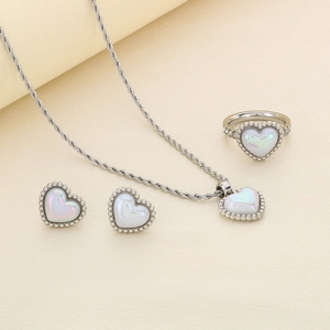 Three-piece silver steel set with heart-shaped white shell necklace, studs and ring