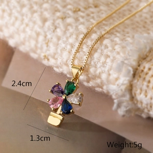 Detail of flower pendant necklace showing 2.4cm height and 1.3cm width dimensions