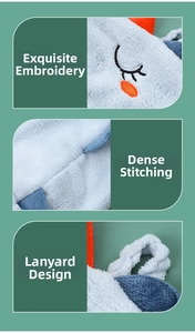 Detail of hanging loop and fine embroidery on cute double-layer hand towel
