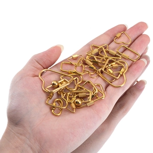 Handheld gold stainless steel geometric clasps including heart and star shapes