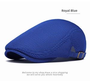 Detail of navy blue mesh ivy cap showing breathable honeycomb fabric and metal buckle