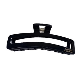 Minimalist black rectangle cutout claw clip with glossy finish and gold text